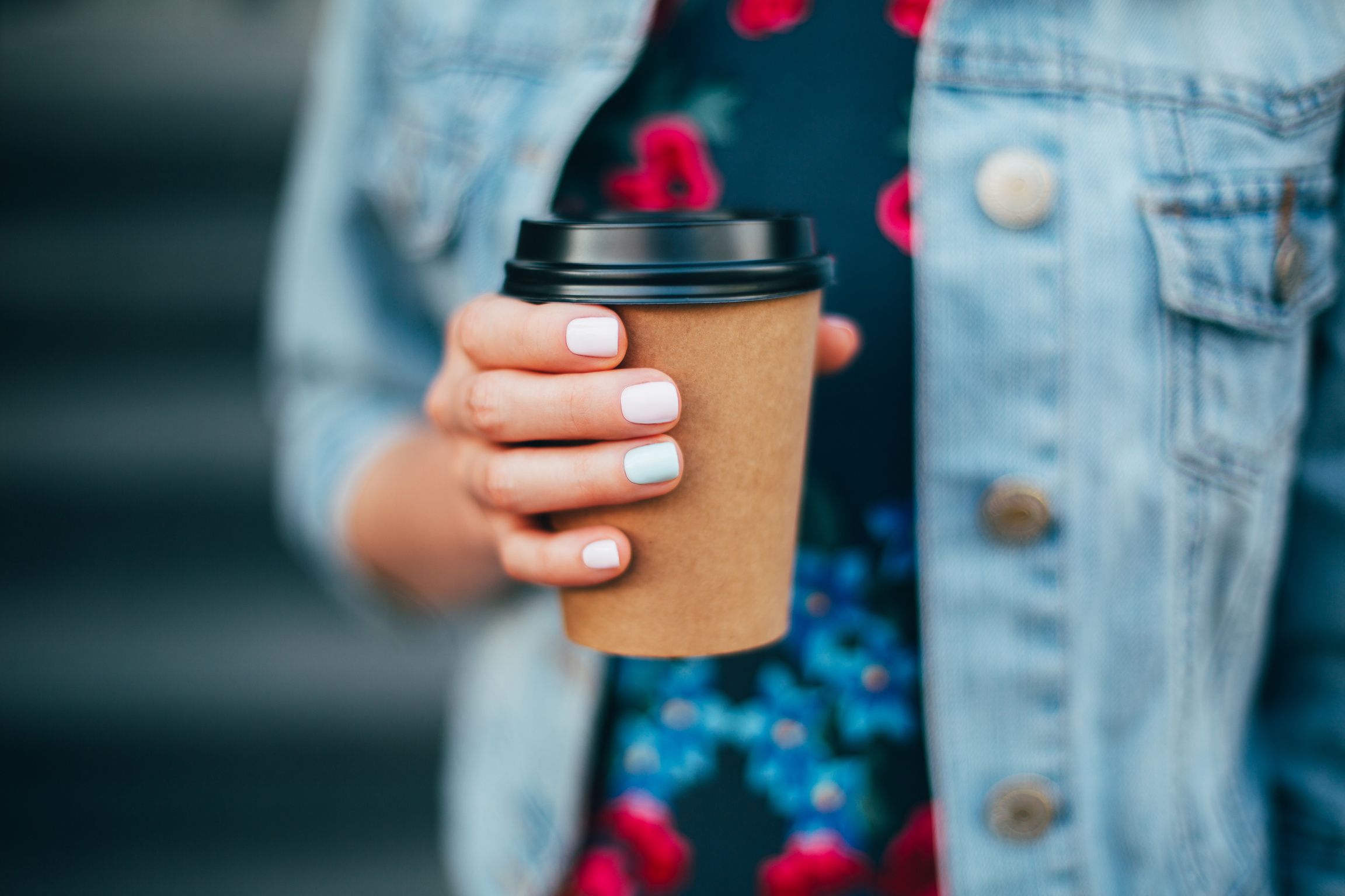 Woman Holding a Takeaway Coffee Cup